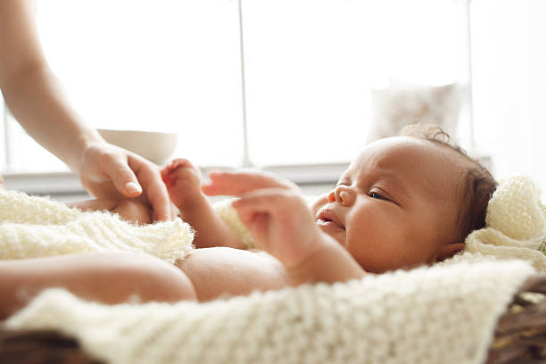 istock Little baby playing with mother hand, free space 624492352