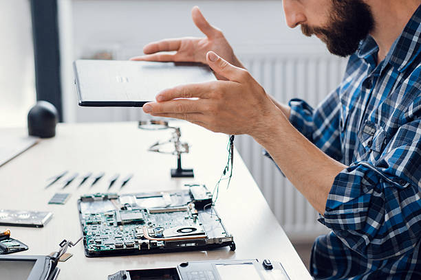 istock Laptop disassembling at electronic repair shop 624493274