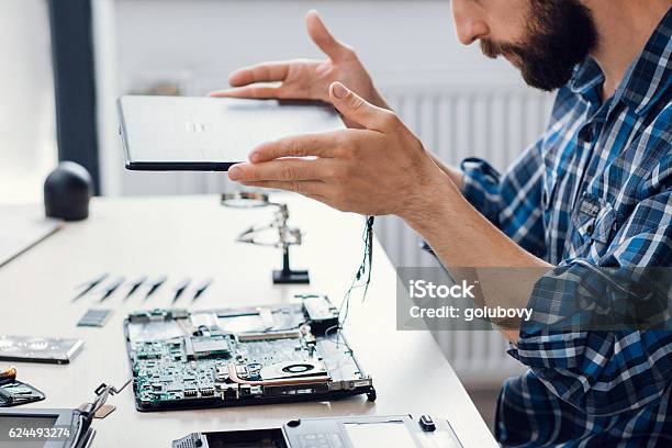 Laptop Disassembling At Electronic Repair Shop Stock Photo - Download Image Now - Repairing, Laptop, Computer