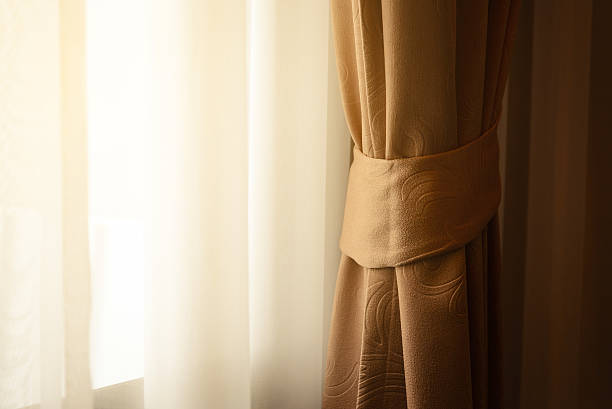 istock luxury curtain on the window decoration interior 624494390