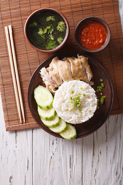 istock Hainanese chicken rice, chilli sauce and bouillon. vertical top view 624494498