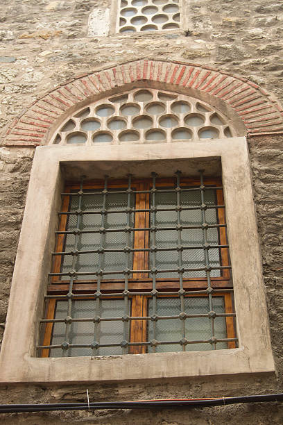 istock Window of old ancient building from natural stones 624495146