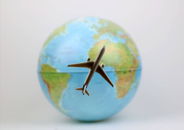 istock Airplane  flies around the  world 624495184
