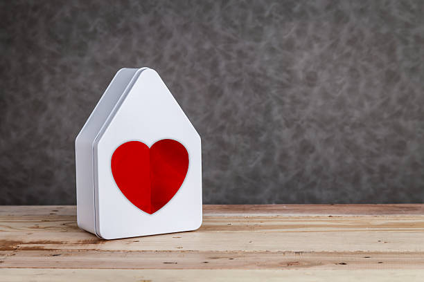 istock home sweet home house model with red on grey background 624495436