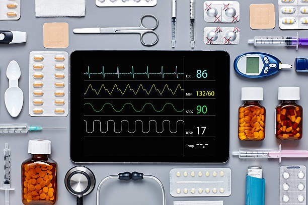 istock Pulse trace displayed on digital tablet amidst medical equipment 624510400