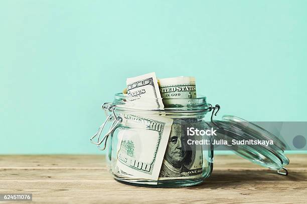 Dollar Bills In Glass Jar Saving Money Economy Finance Concept Stock Photo - Download Image Now