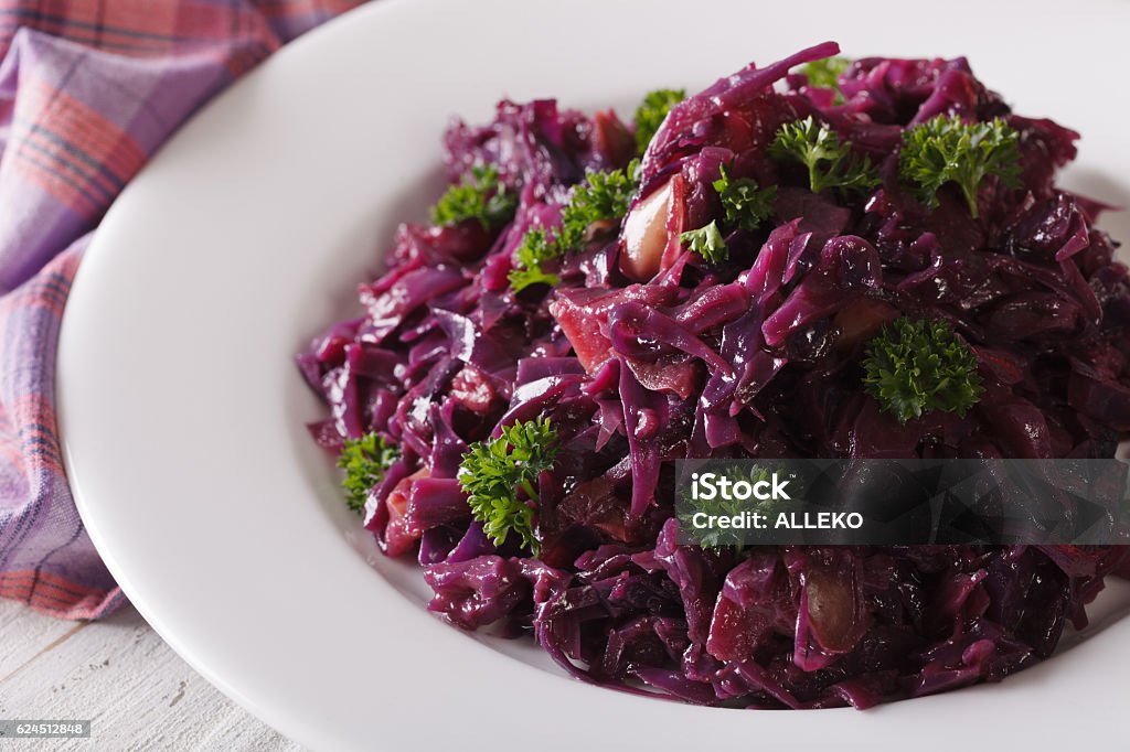 Braised red cabbage close-up on a plate. horizontal Delicious braised red cabbage close-up on a plate. horizontal Appetizer Stock Photo