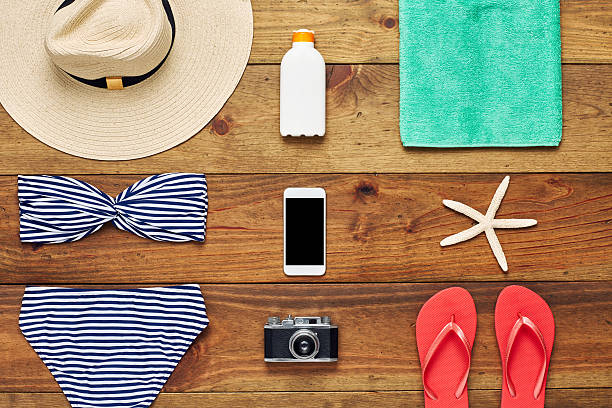 istock Flat lay of smart phone surrounded with beach accessories 624512990