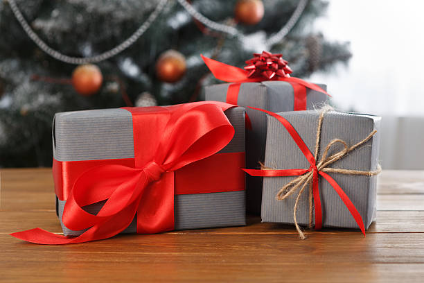 istock Christmas present on decorated tree background, holiday concept 624529434