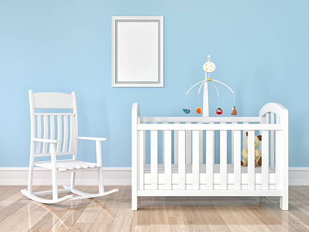 istock Crib, rocking chair with frame on wall 624529878