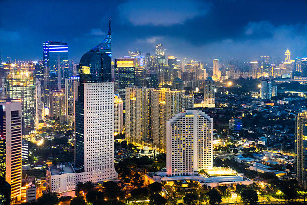 Jakarta skyline at dusk Jakarta skyline at dusk jakarta skyline stock pictures, royalty-free photos & images