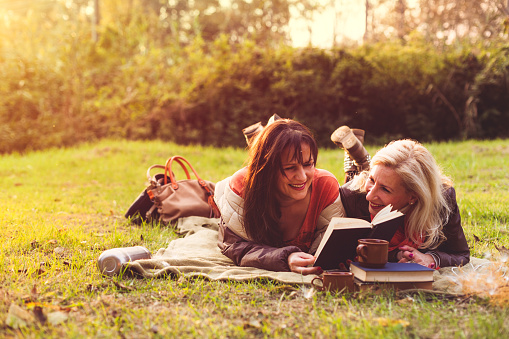 Happy women reading book