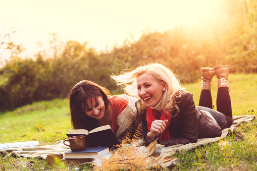 Happy women reading book