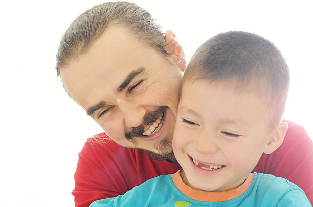 istock Happy father and boy smiling 624533442