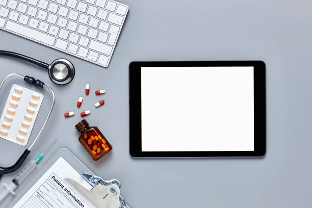 istock Digital tablet with medical equipment on gray background 624533456