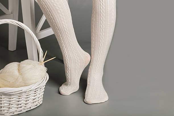 Female Feet In White Knitted Tights Near The Basket Stock Photo - Download  Image Now - iStock