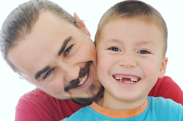 istock Happy father and boy smiling 624533658