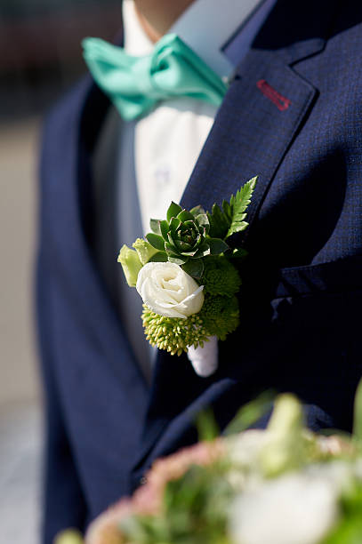 istock groom is with boutonniere 624539520