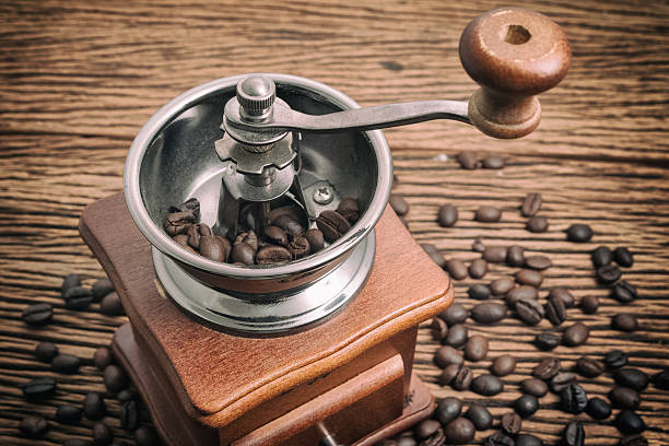istock Vintage manual coffee grinder with coffee bean 624540410