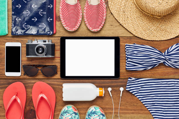 istock Flat lay of digital tablet surrounded with beach accessories 624540766
