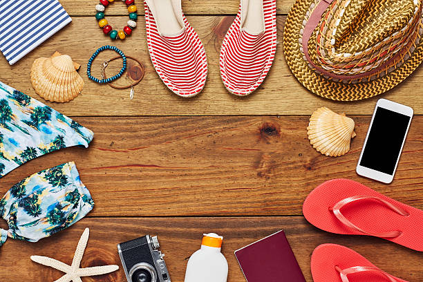 istock Travel and beach essentials flat lay on wooden floor 624543676