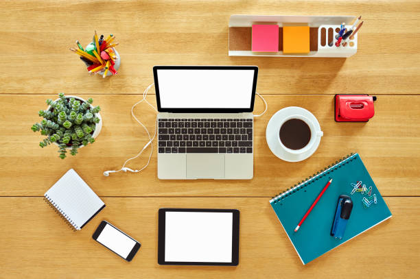 istock Various digital technologies with office supplies and coffee cup on a wooden table 624544124
