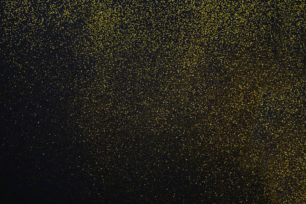 istock Golden glitter sand texture on black, abstract background. 624544208
