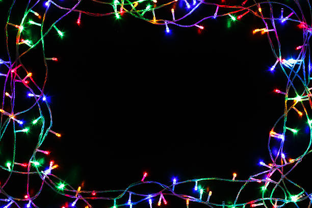 istock christmas lights border on black background 624544770
