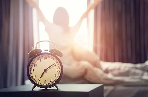 Photo of alarm clock having a good day in morning.