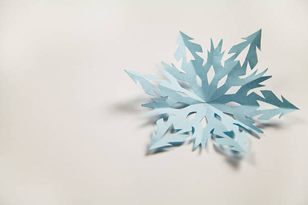 istock Fine paper snowflake cut out. 624566222