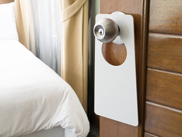 istock do not disturb sign at the door 624569316