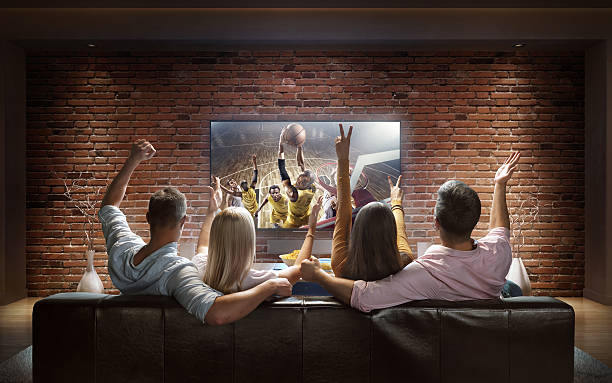 istock Couples watching Basketball game at home 624570626
