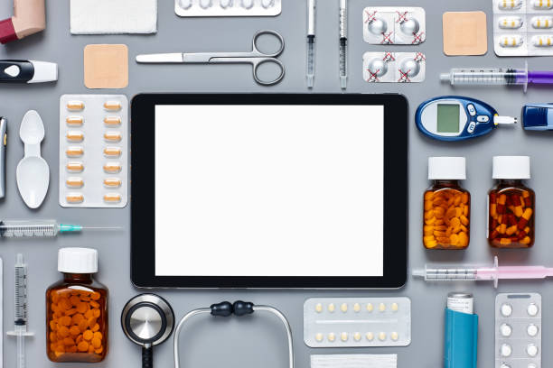istock Flat lay of digital tablet surrounded with various medical equipment 624592844