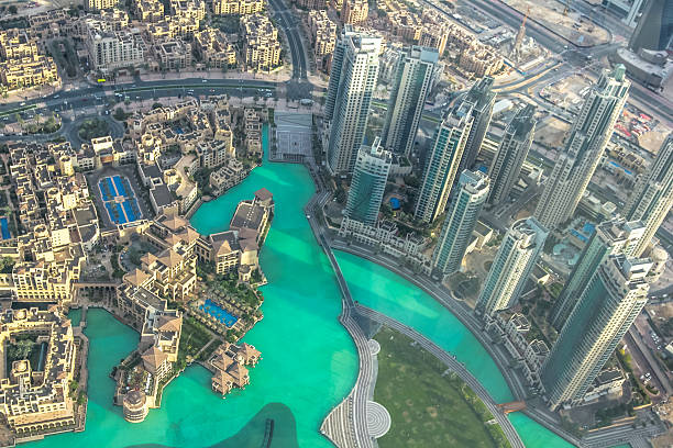 Burj Khalifa Lake aerial Aerial view of Dubai Fountain area and Burj Khalifa Lake and skyscrapers in Dubai downtown, United Arab Emirates, from top. dubai mall stock pictures, royalty-free photos & images