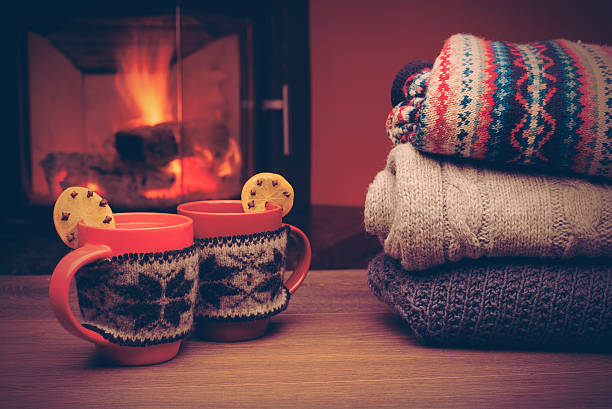 istock Cup with Christmas ornament near fireplace. 624592968