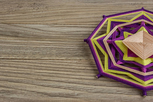 istock Mandala, star of woolen threads, on wooden boards 624593350