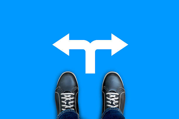 istock Black casual shoes making decision at the crossroad 624614976