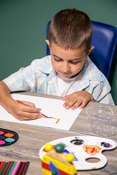 istock Small child painting with watercolors. 624615344