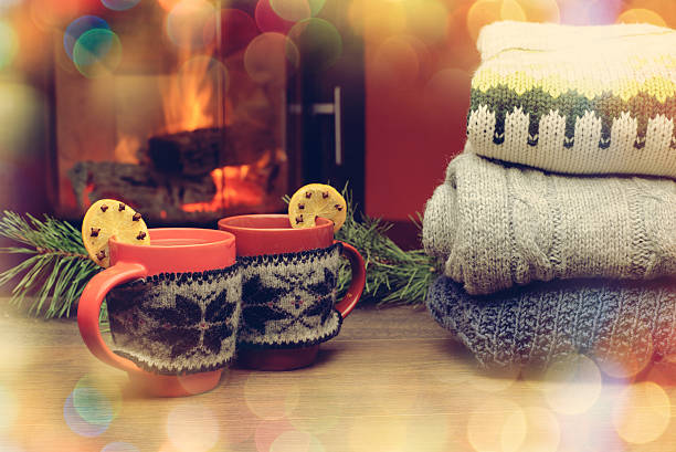 istock Cup with Christmas ornament near fireplace. 624615560