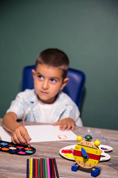 istock Small child painting with watercolors. 624615788