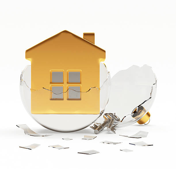istock Broken glass Christmas ball with golden house inside on white 624615906