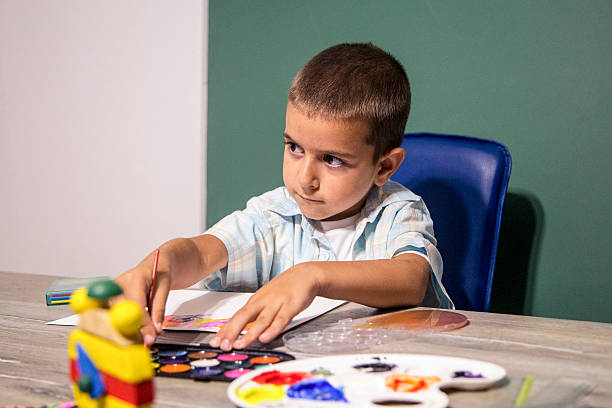 istock Small child painting with watercolors. 624616496