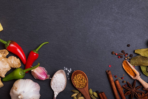 istock Fresh and dry spices on black stone background 624626218