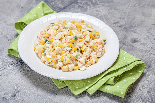 istock Salad with crab sticks, corn, cucumber, and eggs 624626608