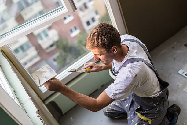 istock Plasterer renovating indoor walls and ceilings. 624627932