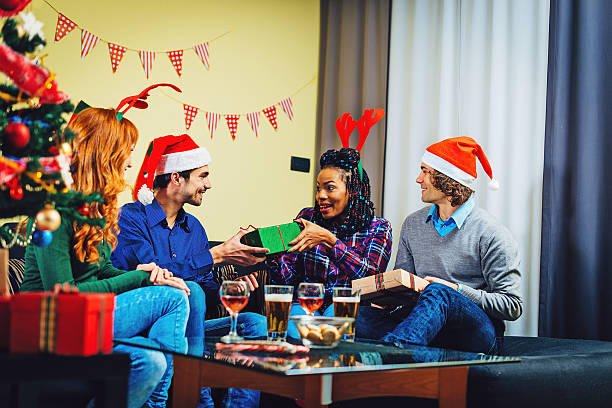 istock Christmas party with two couples at home 624628196