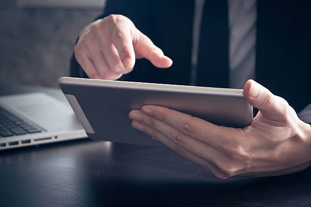 istock Close up of Businessman using tablet on the office desk. 624630884