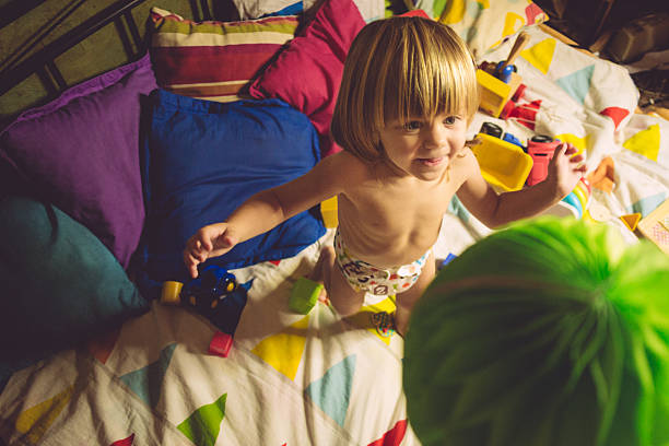 istock Happy Kid Jumping on Bed 624652460