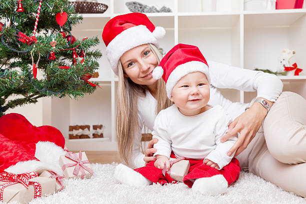 istock Mother with baby boy celebrating Christmas 624652960