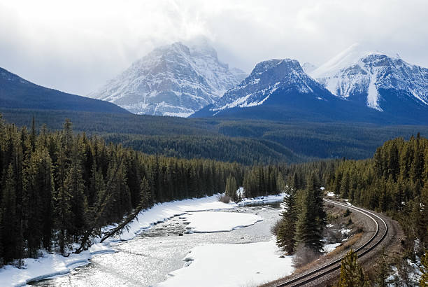 istock Bow River and Mountain Range in Winter, Canadian Rockies, Canada 624653694